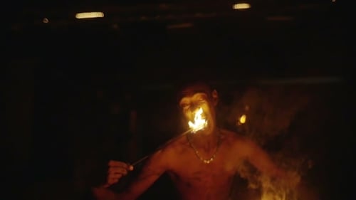 Fire Juggler Performing at Night