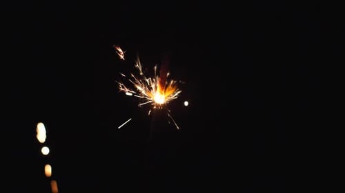Sparkler Burning Brightly in the Dark Night