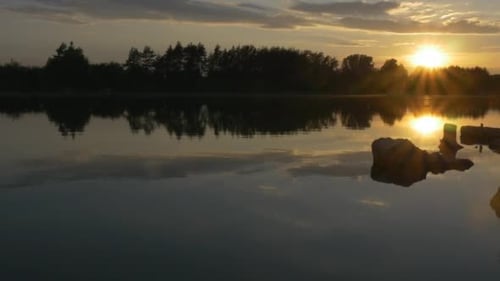 Sunset on The River, Silhouettes of Trees And Sky