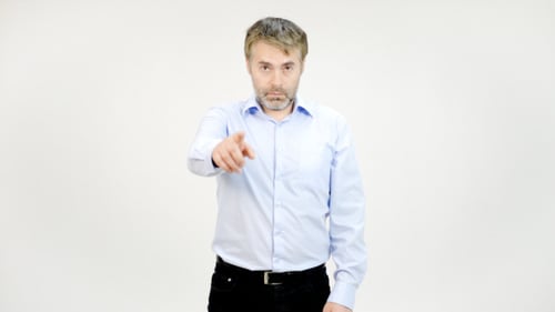 Businessman Pointing and Inviting to Office