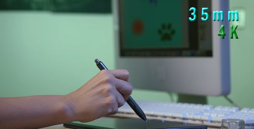 Hand Using Stylus for Digital Art on Tablet