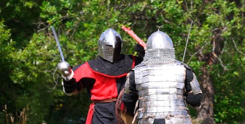 Men in Armor Fight with Swords in a Field