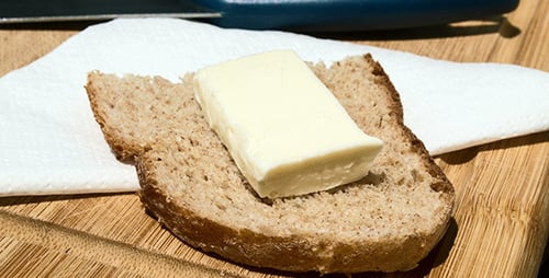 Butter Melting on Slice of Wheat Bread