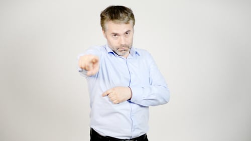 Man Points Directly at the Camera