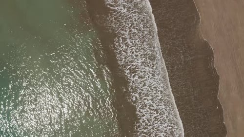 Drone view of waves and shoreline