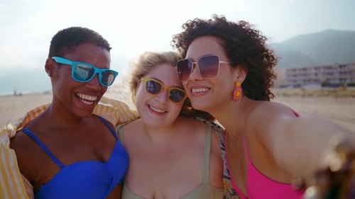 young women having fun on the beach