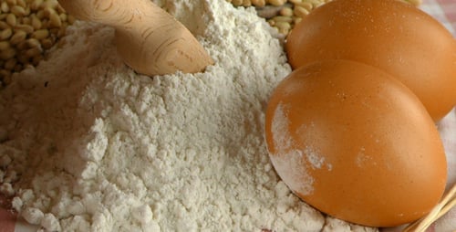 Close Up of Baking Ingredients: Eggs, Flour, Grain