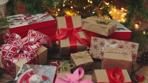Pile of Beautifully Wrapped Christmas Presents Under Tree