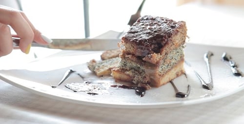 Woman Eats The Sweet Cake In Restaurant