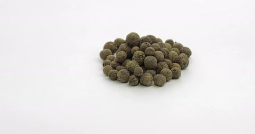 Pile of Allspice Berries on White Background