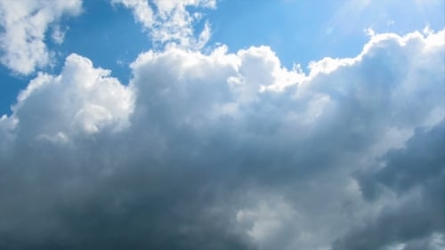 Clouds Moving In The Blue Sky.