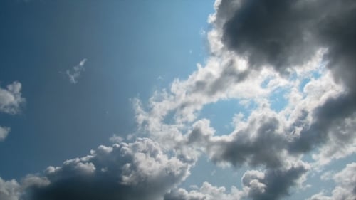 Blue Sky with Puffy White Cloud Time Lapse