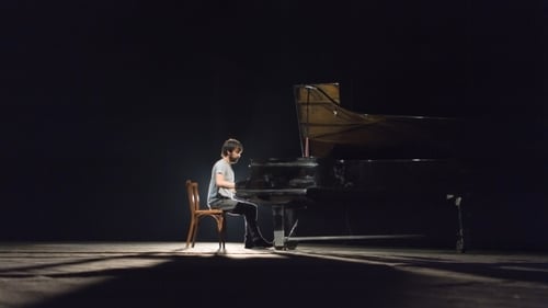 Pianist Performs with Passion Under Dramatic Spotlight