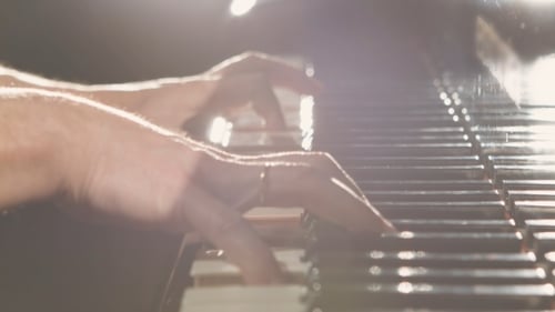 Piano Keys Close Up with Musician's Hands