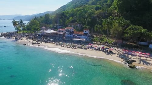 Aerial View of Tropical Beachfront Resort on Sunny Day