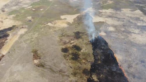 Aerial View of Field Fire Burning