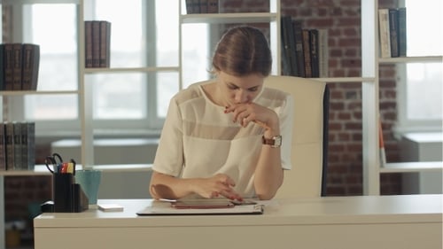 Businesswoman In The Office At The Table Working