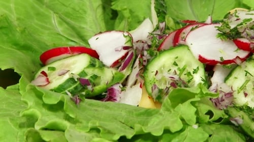 Vegetable Salad Being Dressed with Mayonnaise