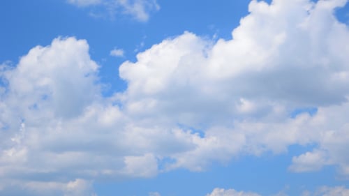 White Clouds Flowing in Blue Sky Time-Lapse