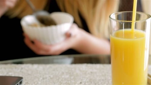 Woman Eating Cereals For Breakfast