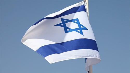 Israeli Flag Waving Against Clear Blue Sky