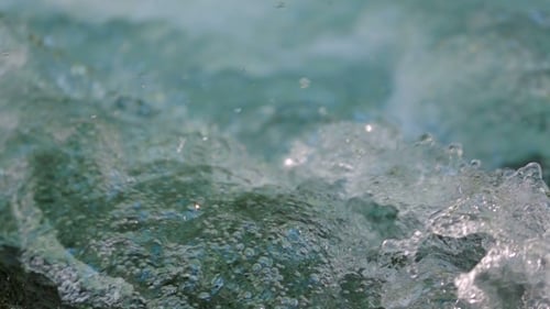 Stream Flowing Water Splashing And Spraying.