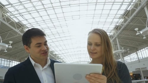 Business People With Tablet PC In Office Building