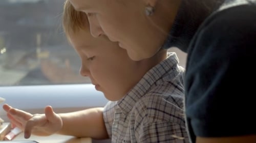 Boy Playing Games In Tablet PC