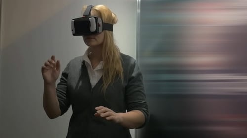 Woman Uses Virtual Reality Headset Indoors