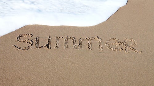 Wave Erases Summer Writing in Sand