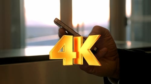 Close up of Hand Holding Phone by Window