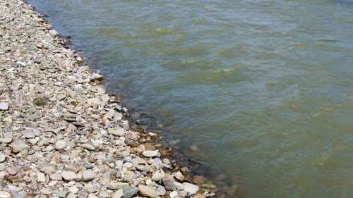 Stones On Beach And Sea Water