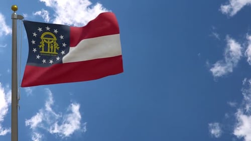 Waving Georgia State Flag on a Clear Sky