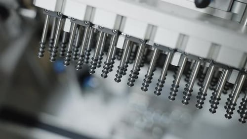 Close Up of Manufacturing Machine with Metal Rods