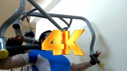 Man Exercising On Chest Press Machine