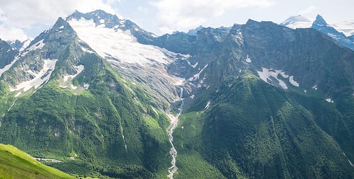 Scenic Mountain Landscape with Greenery and Snow
