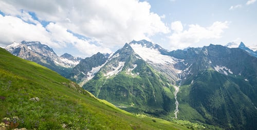 Beautiful Mountain Range with Green Hills and Clouds