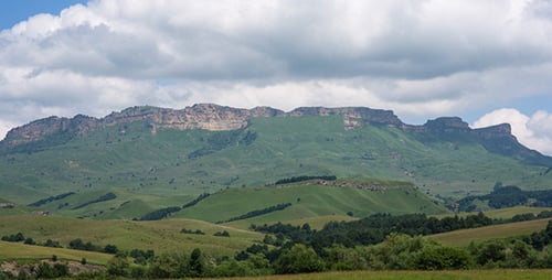 Green Hills and Mountains on a Sunny Day