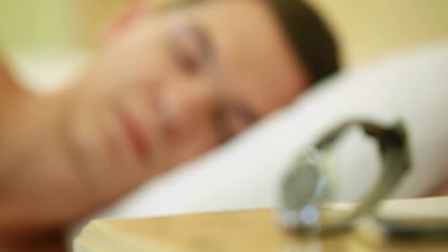 Young Adult Wakes Up Lying in Bed