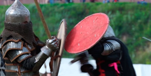 Medieval Warriors Engaging in Combat with Spears and Shields