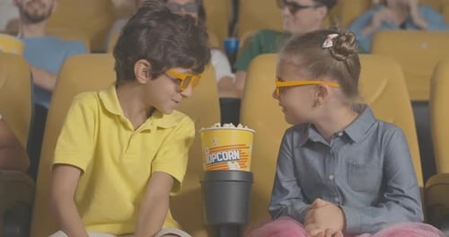 Excited Kids Discussing Interesting Film in 3d Cinema and Clapping. Portrait of Happy Middle Eastern