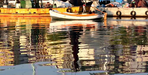 Reflections in a Calm Harbor With Boats