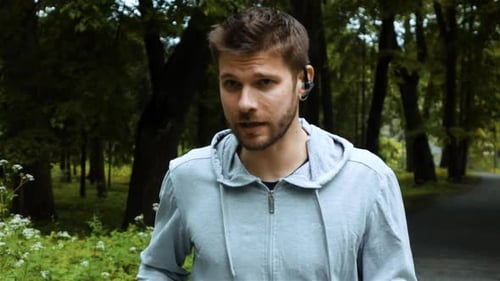 Road Runner Man Talking By Phone with Bluetooth Headset