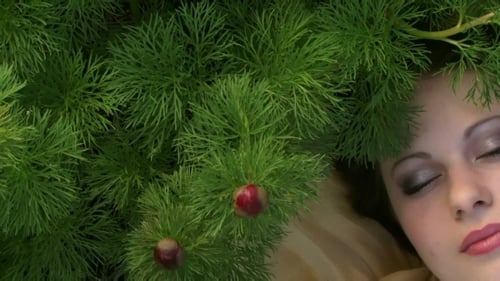 Smiling Woman with Green Plants and Red Buds