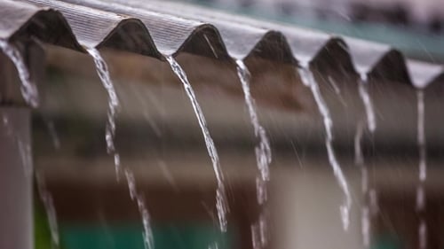 Rain Falling From Roof Edge During Daytime