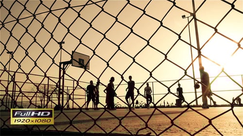 Basketball Game at Sunrise on Urban Court