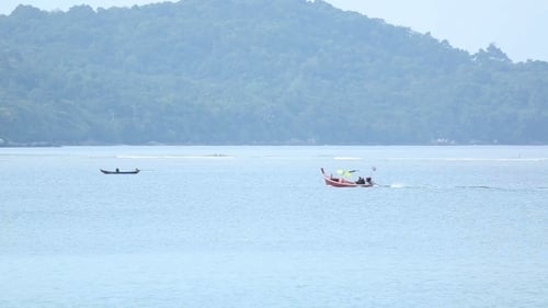 Boats Cruising on Tropical Bay Water