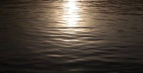 Sunlight Reflections off Rippling Ocean Water at Sunset