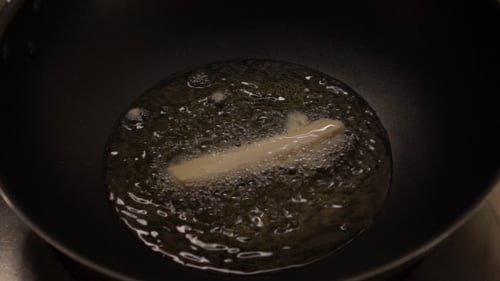 Breaded Food Stick Frying in Hot Oil