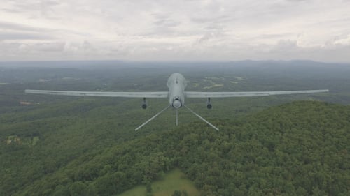 Drone Flies Over Lush Green Forest Landscape